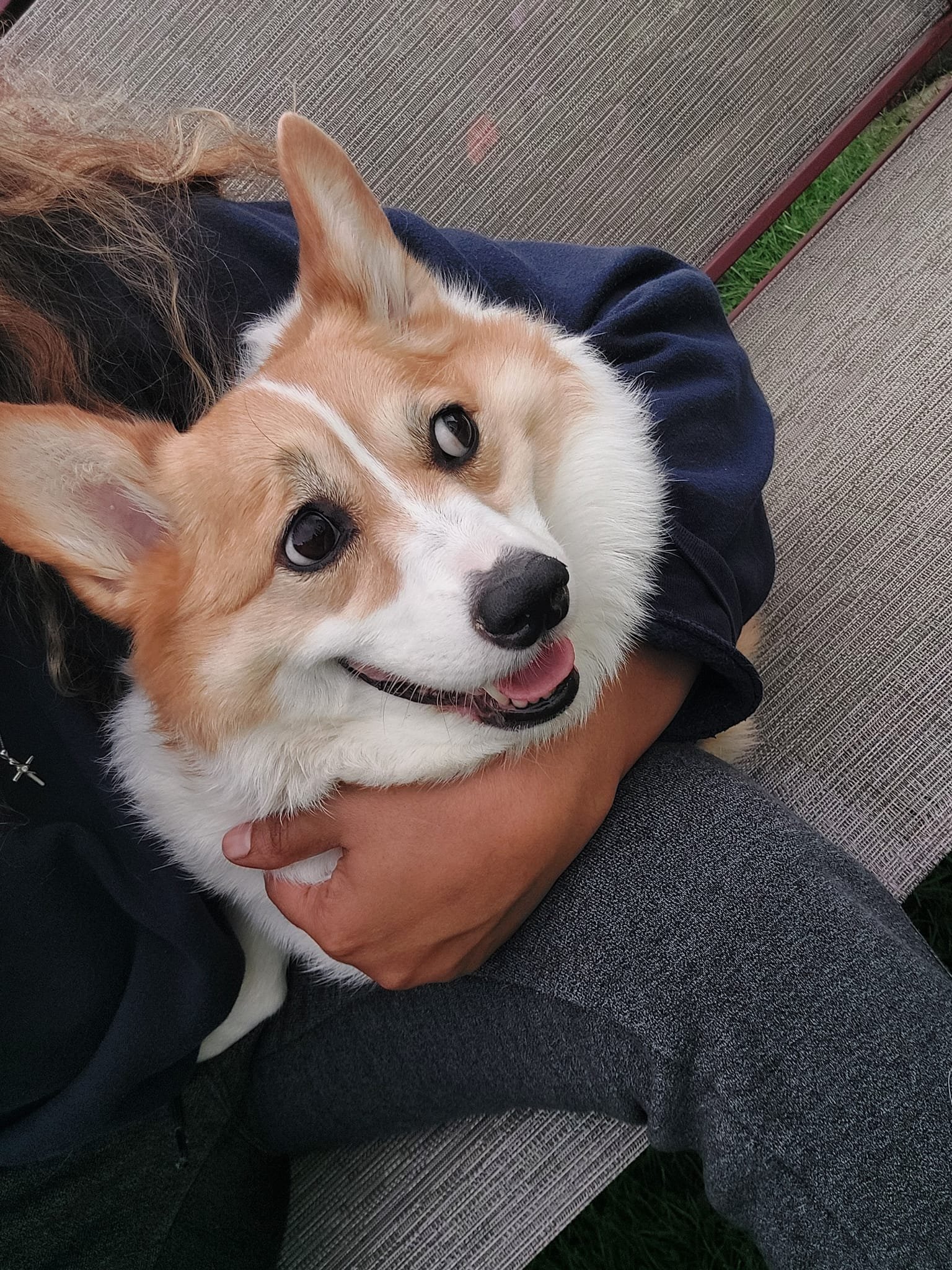 Adult Mia close-up, smiling while held